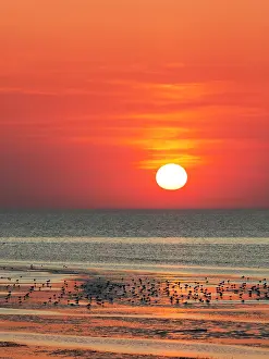 Cuxhaven: Orange-red sunset over the North Sea, Duhnen, Cuxhaven