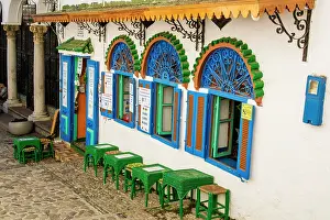 Moorish: Outdoor cafe along a narrow street in the Bab Haha district