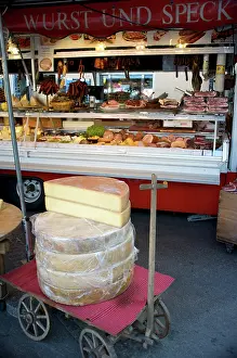 Selling: Outdoor market selling meat and cheese