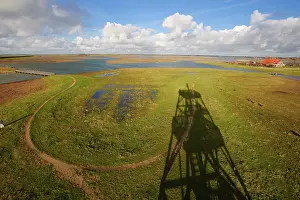 Watchtower: Overview of saltmarsh with shadow of watchtower