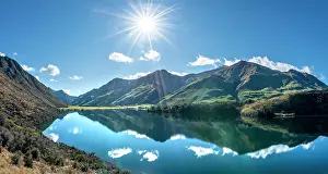 Reflex: Panorama, mountains reflected in a lake, Moke Lake