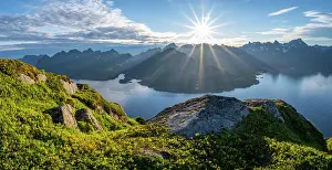 Reflex: Panorama, sun shining on Fjord Raftsund and mountains