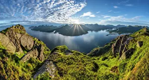 Reflex: Panorama, sun shining on Fjord Raftsund and mountains