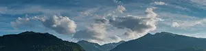 Gallen: A panorama view of mountain landscape covered in