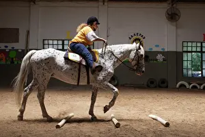 Saddle: Paraplegic woman on horse in a horse therapy center