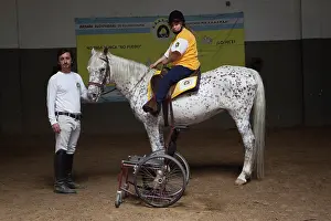 Saddle: Paraplegic woman on horse in a horse therapy center