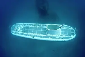 Passes: Passanger Submarine - passes the Carthaginian Wreck