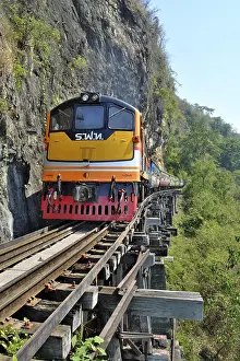 Burmese: Passenger train runs on wooden bridge, Thamkra Sae