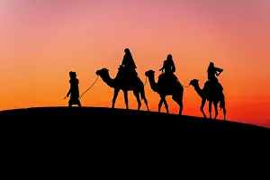 Model: Three passengers and their handler travel in the