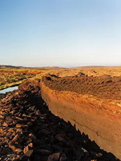Warmth: Peat cutting on Shetland, Scotland. the