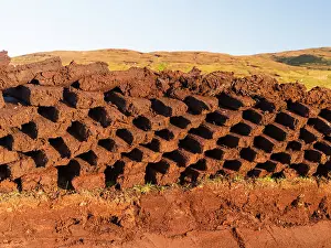Warmth: Peat cutting on Shetland, Scotland. the