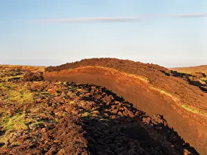 Warmth: Peat cutting on Shetland, Scotland. the