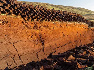 Warmth: Peat cutting on Shetland, Scotland. the