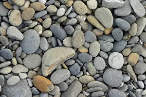 Oval: Pebbles on beach