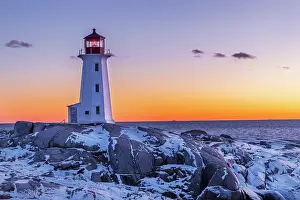 Lighthouse: Peggy's Cove Lighthouse in winter at sunset, Nova Scotia