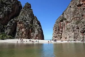 Incidental: People on the beach in the gorge Torrent de Pareis