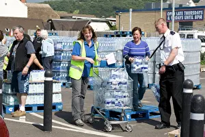 Floods: People collecting free bottled water from Tesco car park
