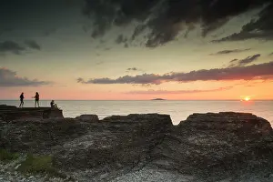 Seastack: People enjoying the sunset on the limestone seastacks