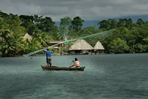 Casting: People fishing - casting nets. Dulce River - Guatemala