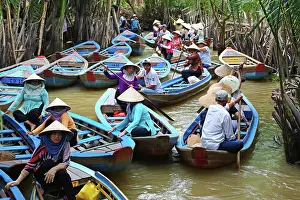 Canals: People on Sampan boats on canals on Con Lan (Unicorn) Is