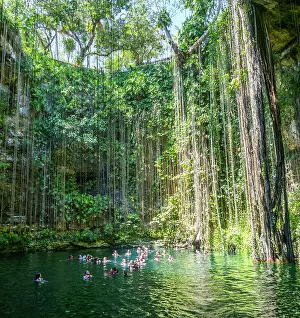 Limestone: People swimming in limestone sinkhole pool, Ceno
