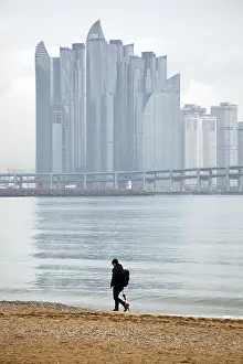 Skyscrapers: People walking along Gwangalli Beach with Machunroo