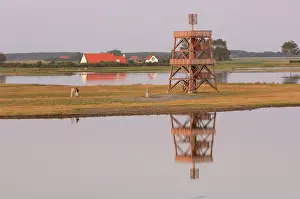 Watchtower: Two people walking near watchtower on island at the southern