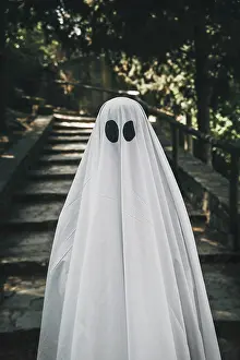 Scary: Person ghost costume standing forest