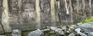 Cliffs: Petroglyphs on a rock wall rising out of Sproat Lake near Port Alberni