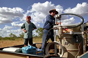 Pump: Petrol pump in outback Australia.Pilot refuelling