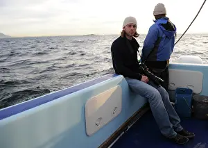 Chris: Photographer - Chris Brunskill in boat photographing