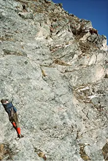 Altitude: PHOTOGRAPHER - on cliff edge photographing Ibex