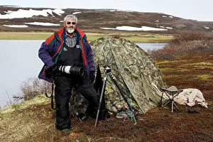 Tents: Photographer - standing outside tent