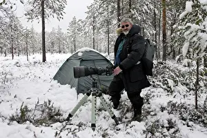 Hides: Photographer - standing by tent with camera