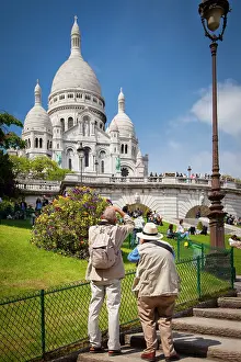 Butte: Two photographers below Basilique du Sacre