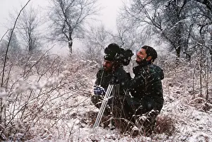 Equipment: PHOTOGRAPHERS - pair filming Hangul / Kashmir Deer in snow