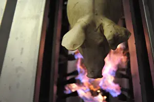 Hung: Pig hanged before its entry into the flaming oven Rodez