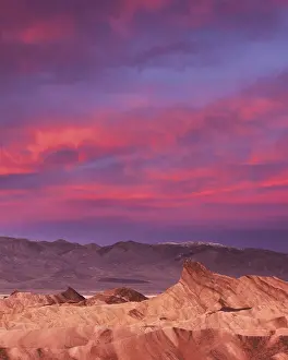 Soar: The pink clouds of dawn soar above Zabriskie Po