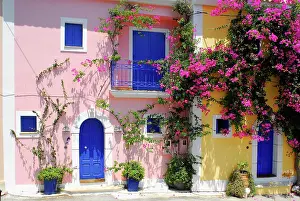 Bougainvillea: Pink and yellow house, blue shutters, Fiscardo