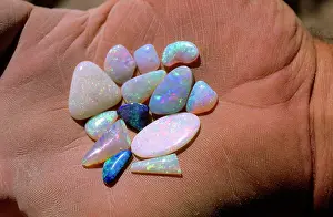 Jewellery: Polished opal held in palm of hand Coober Pedy
