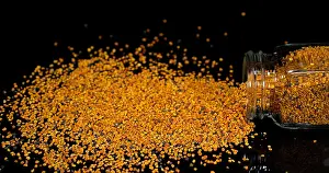 Falling: Pollen Dumplings Falling on Black Background