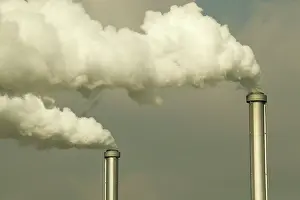 Chimneys: POLLUTION - Smoke bellows from chimneys of factory