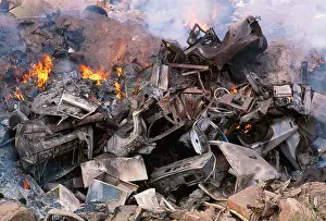 Disposal: Pollution - Waste disposal, cars being incinerated