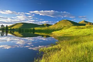 Havre: Pond reflects at days end in the Bears Paw