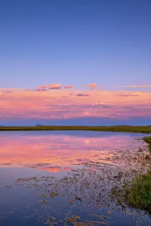 Foothills: Pond reflects sunset clouds near Augusta
