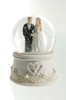 Celebrations: Porcelain bride and groom in a snow globe
