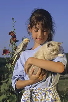 Mallows: Portrait of a young girl with kitten and Cockatiel