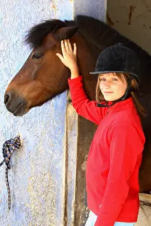 Smiles: Portrait of a young rider with her Horse