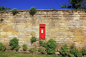Snowshill: A post box in a wall on a summers day near the cotswold vill