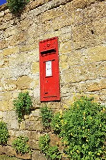 Snowshill: A post box in a wall on a summers day near the cotswold vill